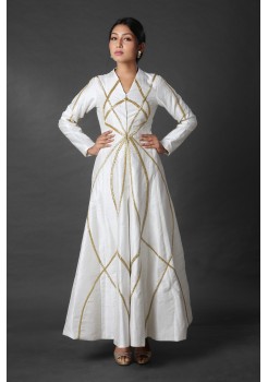 White jacket style dress with cut dana embroidery and white pant.